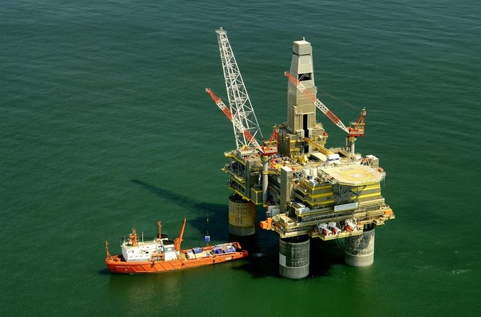 commercial-ship-approaching-oil-rig-russian-seas-preparing-for-oil-and-gas-safety-inspection