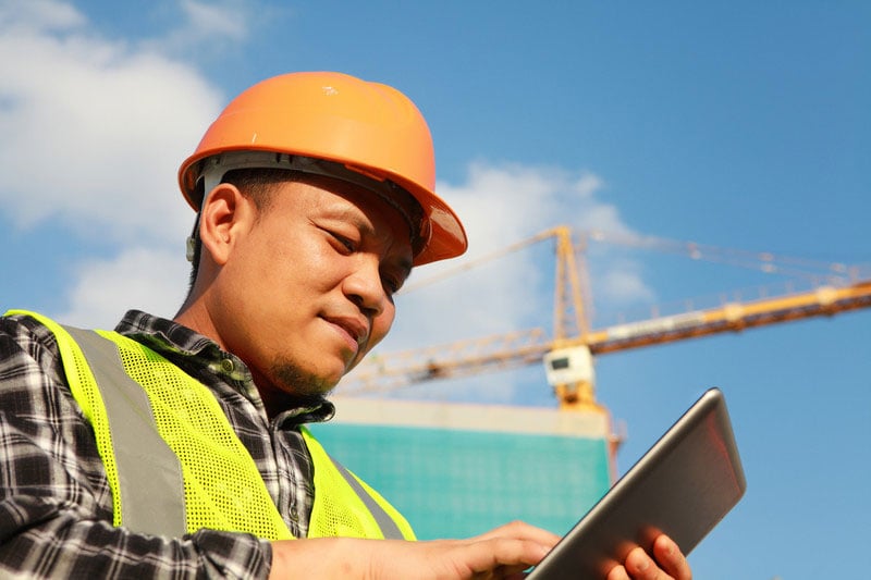 Construction Site worker using a Quality Management App